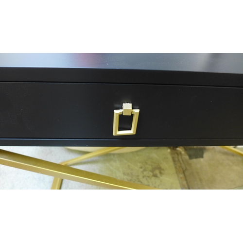 1577 - A black two drawer console table with gold legs