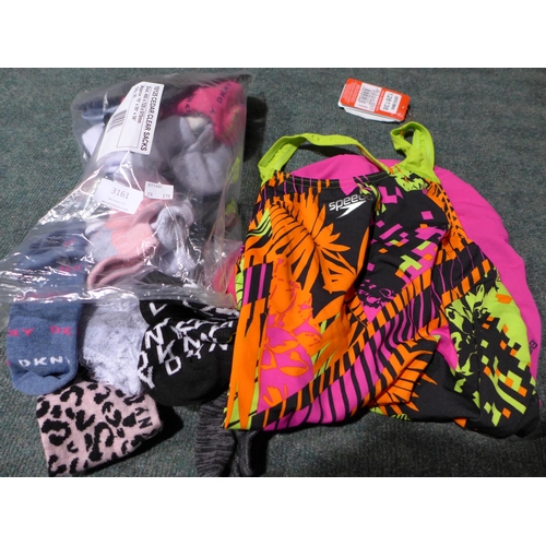 3161 - Bag of women's socks, mixed sizes, brands including DKNY & a Speedo swimming costume * this lot is s... 