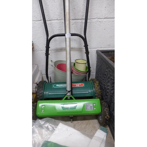 2272 - Florabest scarifier, Qualcast push mower, hoses, lawn edging and qty. of potting shed consumables