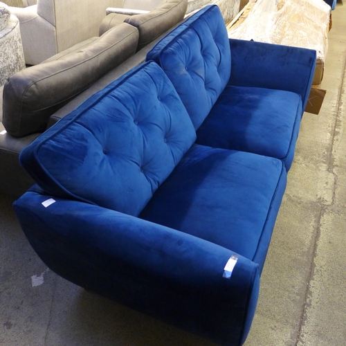 1559 - A Hoxton blue velvet three seater sofa - damaged leg