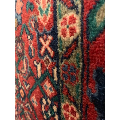 1537 - A washed red ground Persian full pile Hamadan runner 325cm x 109cm