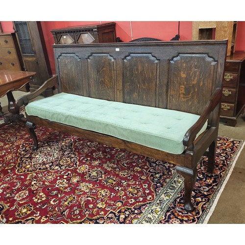 68 - A George III oak settle, 106cms h, 183cms w, 67cms d