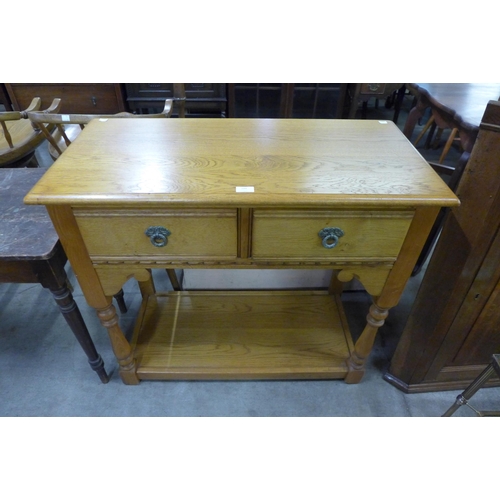 190 - An Old Charm oak two drawer hall table