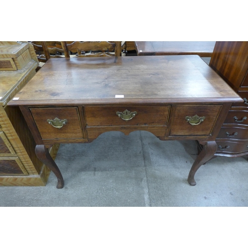 210 - A George III mahogany three drawer side table