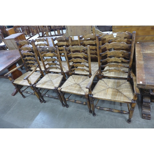 227 - A set of eight George III style beech rush seated ladderback dining chairs