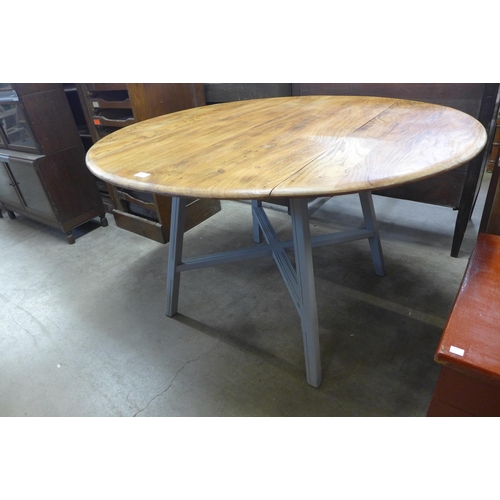 238 - A painted Ercol elm kitchen table