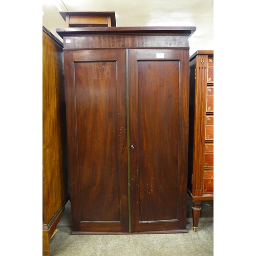 121 - A George IV mahogany fitted two door pigeon hole cabinet