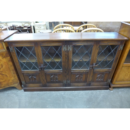 126 - A carved oak bookcase