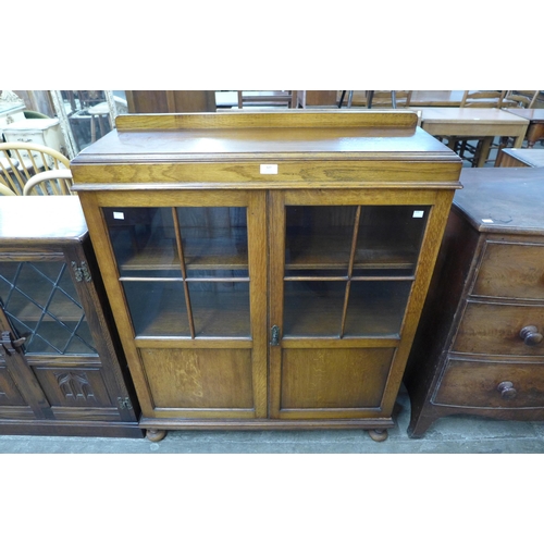 127 - An oak two door bookcase