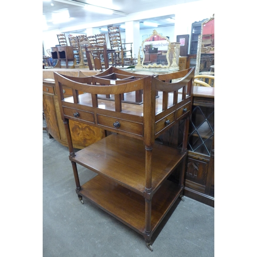 128 - A George IV style mahogany three tier whatnot