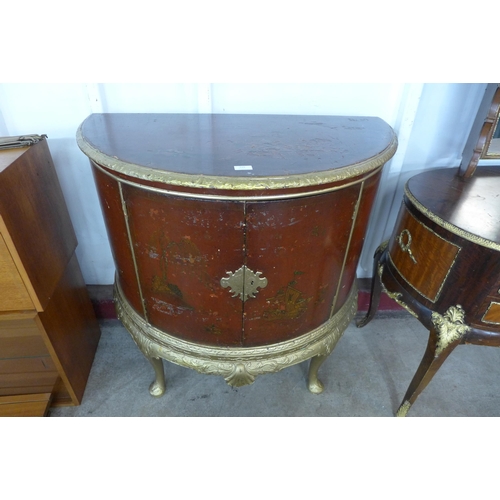 134 - A Chippendale Revival gilt and red Japanned demi lune side cabinet