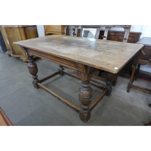 141 - A 17th Century style oak refectory table