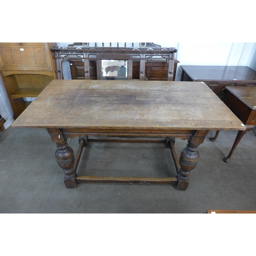 141 - A 17th Century style oak refectory table