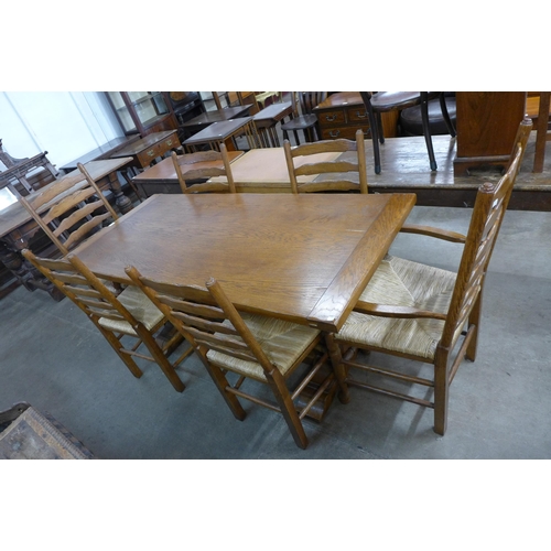 142 - An 18th Century style oak refectory table and six chairs