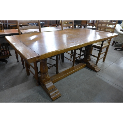 142 - An 18th Century style oak refectory table and six chairs