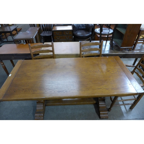 142 - An 18th Century style oak refectory table and six chairs