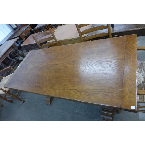 142 - An 18th Century style oak refectory table and six chairs