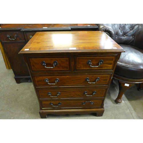 146 - A small inlaid mahogany chest of drawers