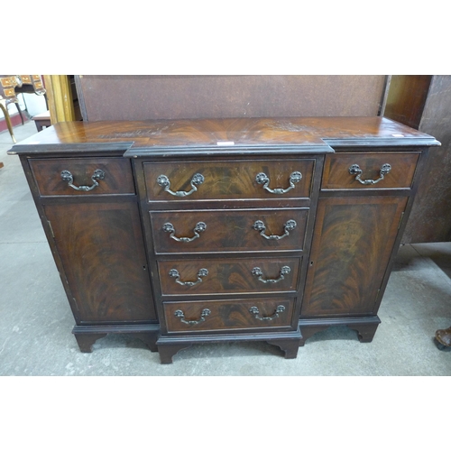 147 - A George III style dwarf sized mahogany breakfront sideboard