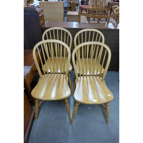 151 - A set of four beech kitchen chairs