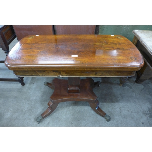 156 - A Victorian figured walnut and Tunbridgeware inlaid fold over games table, on associated base