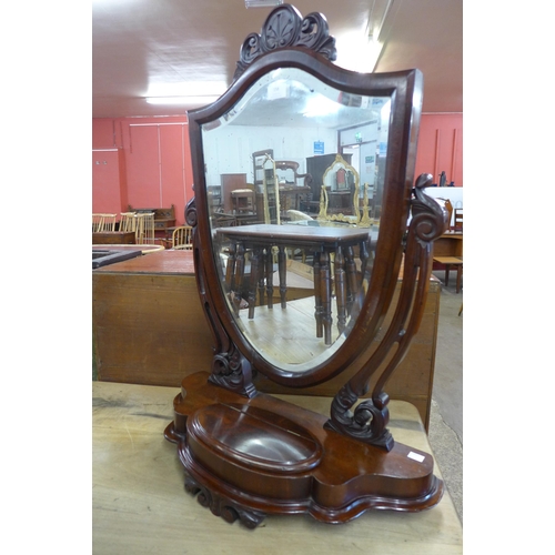 158 - A Victorian mahogany shield shaped toilet mirror