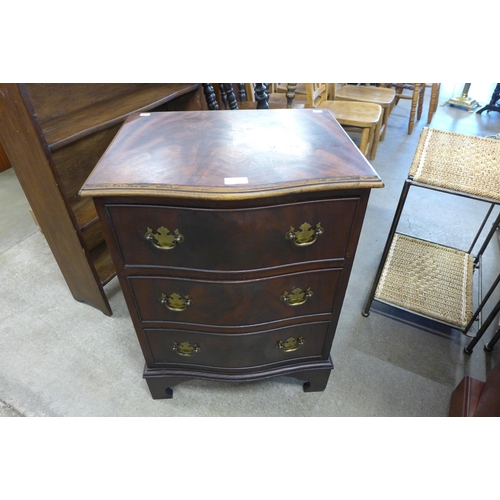 162 - A small mahogany serpentine chest of drawers