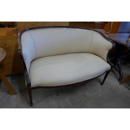 174 - An Edward VII Hepplewhite Revival carved mahogany and fabric upholstered settee