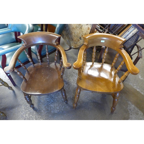 181 - A pair of similar ash and mahogany smokers  chairs