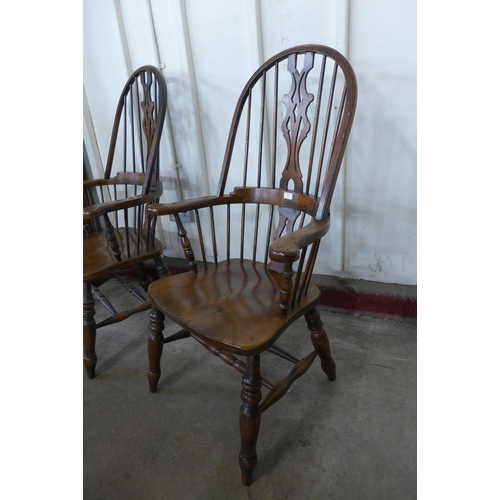 186 - A pair of beech high back Windsor armchairs