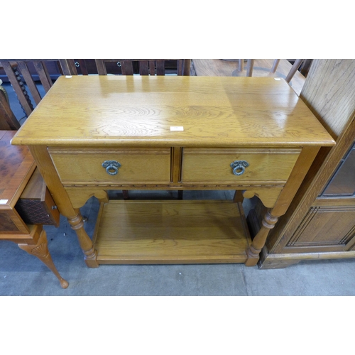 190 - An Old Charm oak two drawer hall table