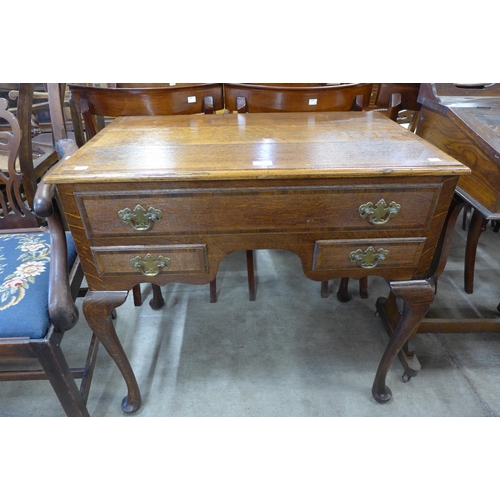 194 - A George III oak lowboy