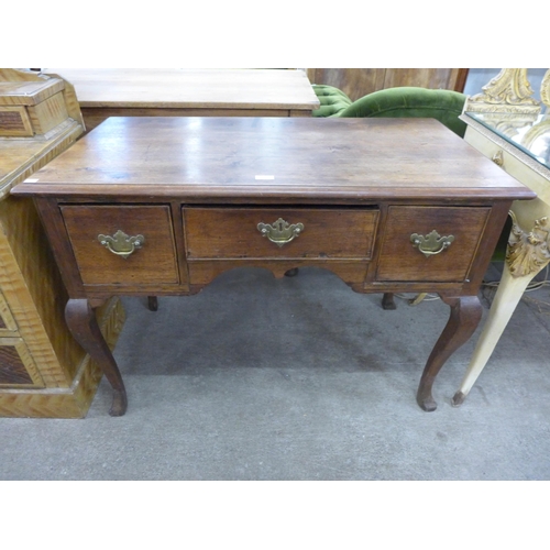 210 - A George III mahogany three drawer side table