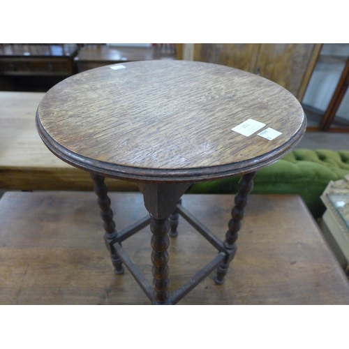 211 - A small oak bobbin turned occasional table