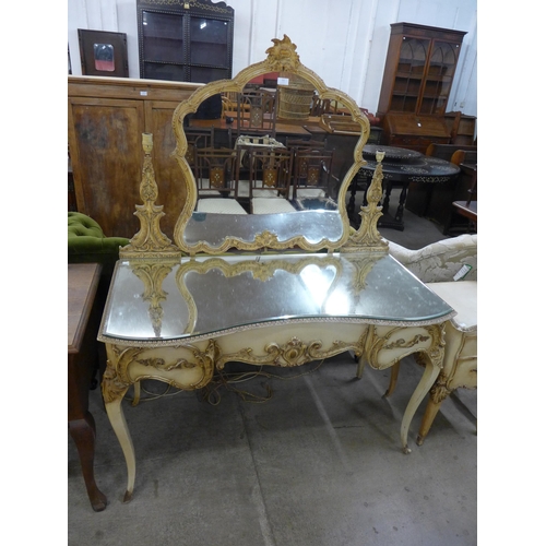 212 - A French cream and parcel gilt dressing table, cheval mirror and table de nuit