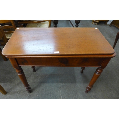 219 - A Victorian mahogany fold-over tea table