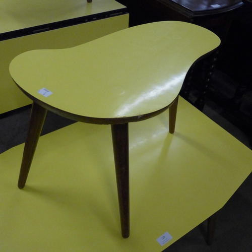 228 - A pair of teak and yellow Formica topped occasional tables, a steel and Formica topped drop-leaf kit... 