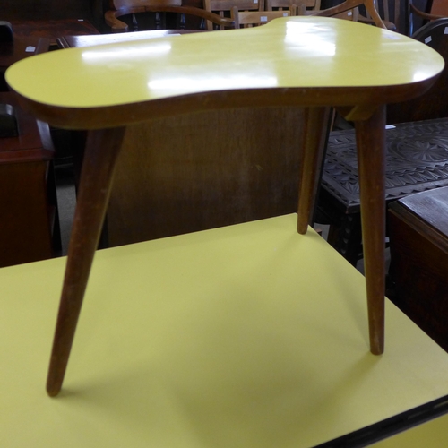 228 - A pair of teak and yellow Formica topped occasional tables, a steel and Formica topped drop-leaf kit... 