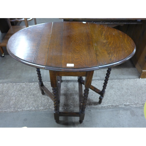 229 - A small oak barleytwist gateleg table