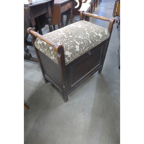 231 - An early 20th Century oak piano stool