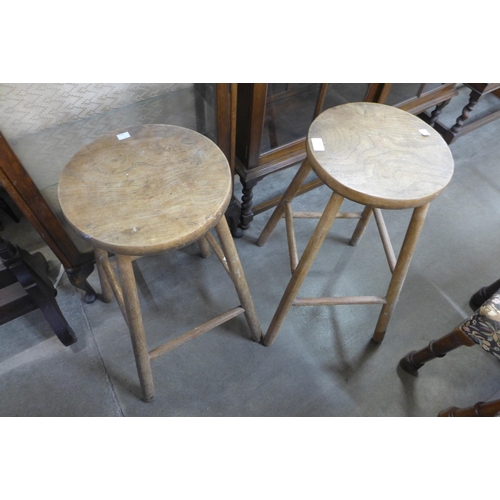 237 - A pair of elm and beech kitchen stools