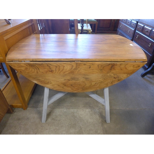 238 - A painted Ercol elm kitchen table