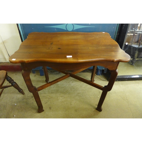 243 - A French fruitwood centre table