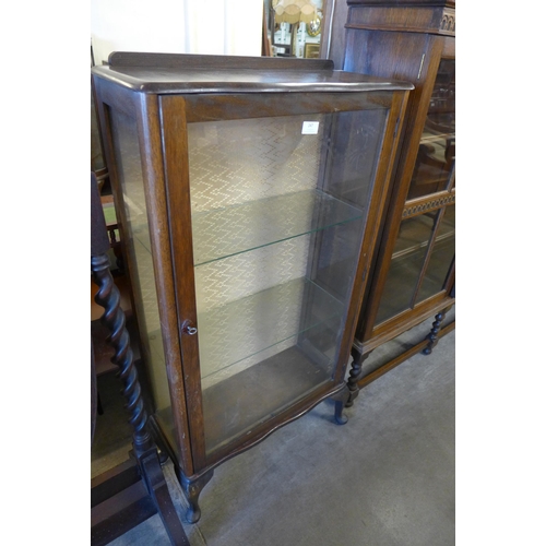 247 - A mahogany single door display cabinet