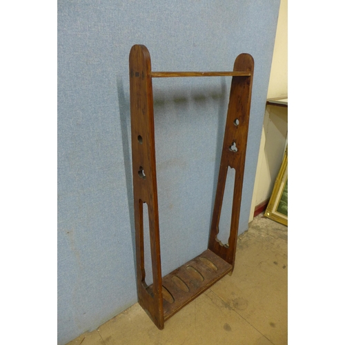 265 - A Victorian Gothic Revival stained pine gun rack