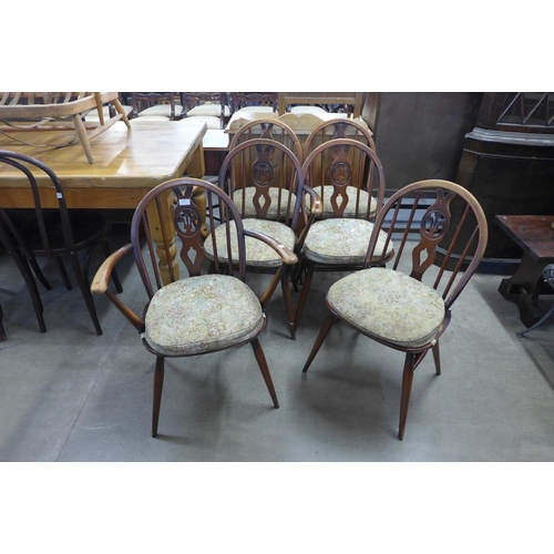 283 - A set of six Ercol dark elm and beech fleur de lys chairs