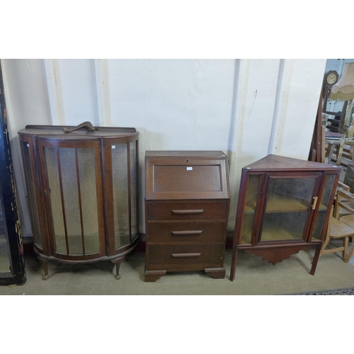 287 - An Art Deco oak bureau and two display cabinets