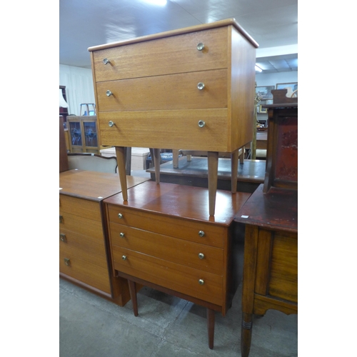 29 - A pair of small teak chests of drawers