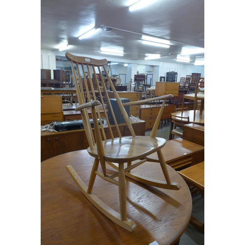 30 - An Ercol Blonde elm and beech Goldsmith rocking chair