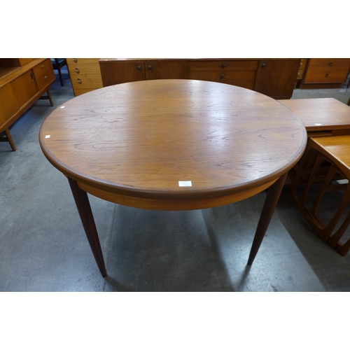 34A - A G-Plan Fresco teak circular extending dining table